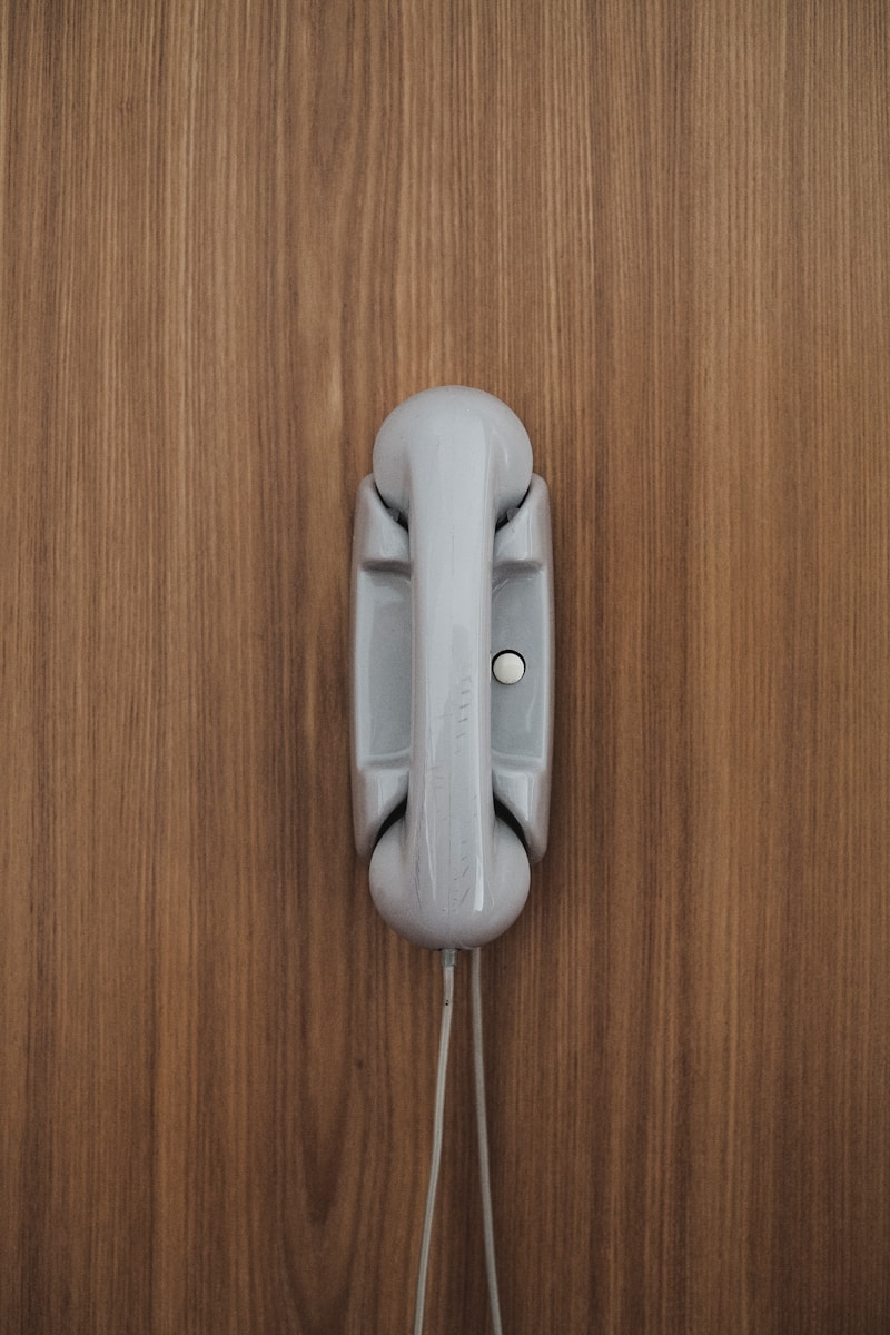 gray home phone on wall
